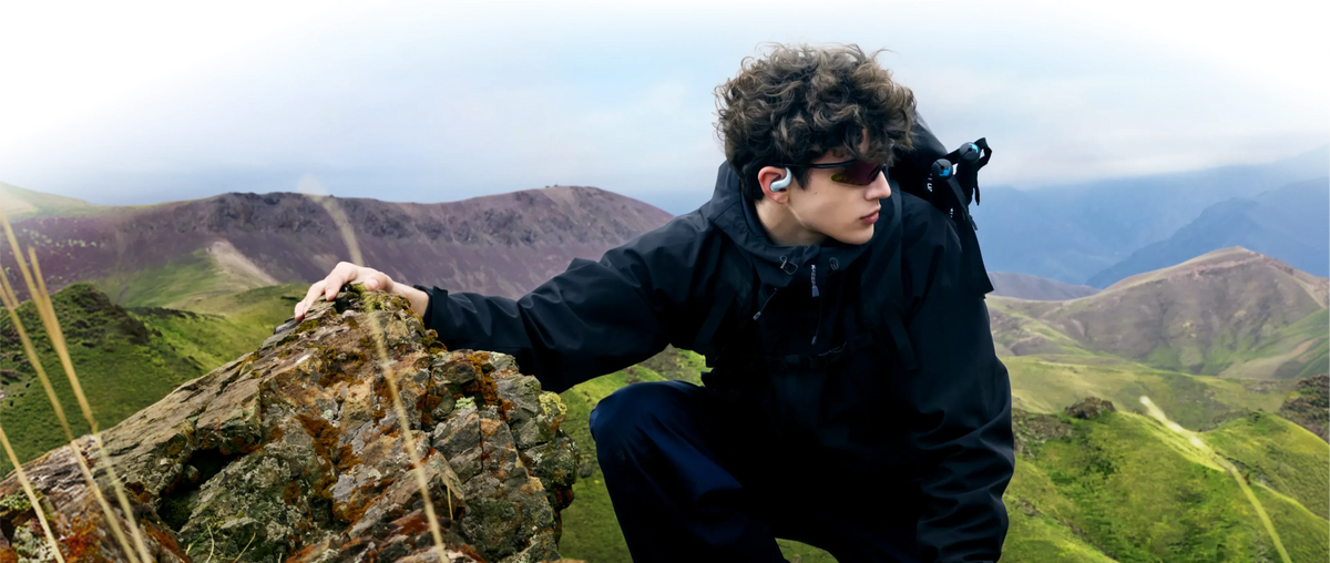 Outdoor athlete wearing Shokz OpenFit Air 2 demonstrating secure ear-hook comfort