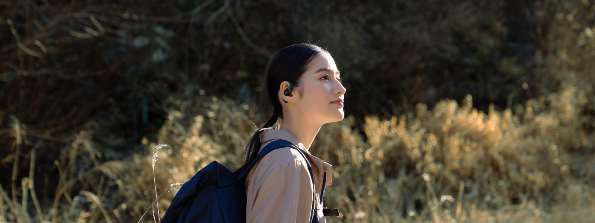 walk with open-ear headphones
